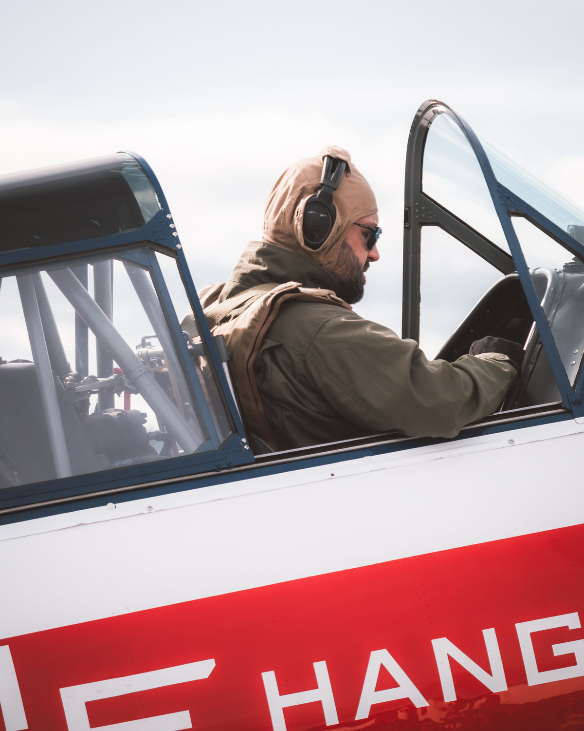Pilot wearing aviation headset in cockpit ready for takeoff