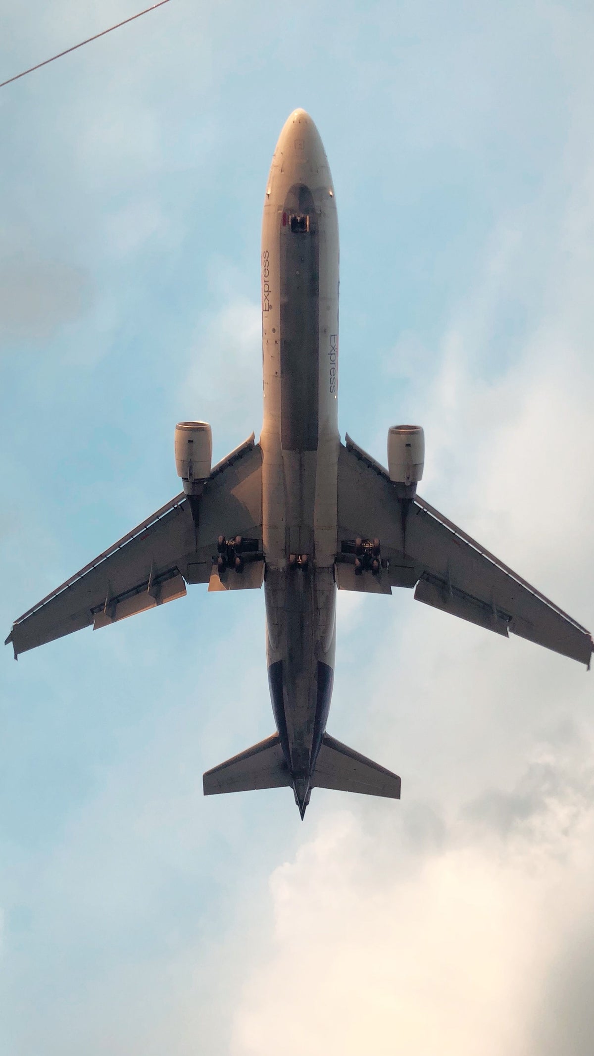 Commercial aircraft flying in clear blue sky - Jhears Aerospace hero banner